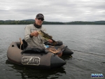 Warren with a bass caught on fly